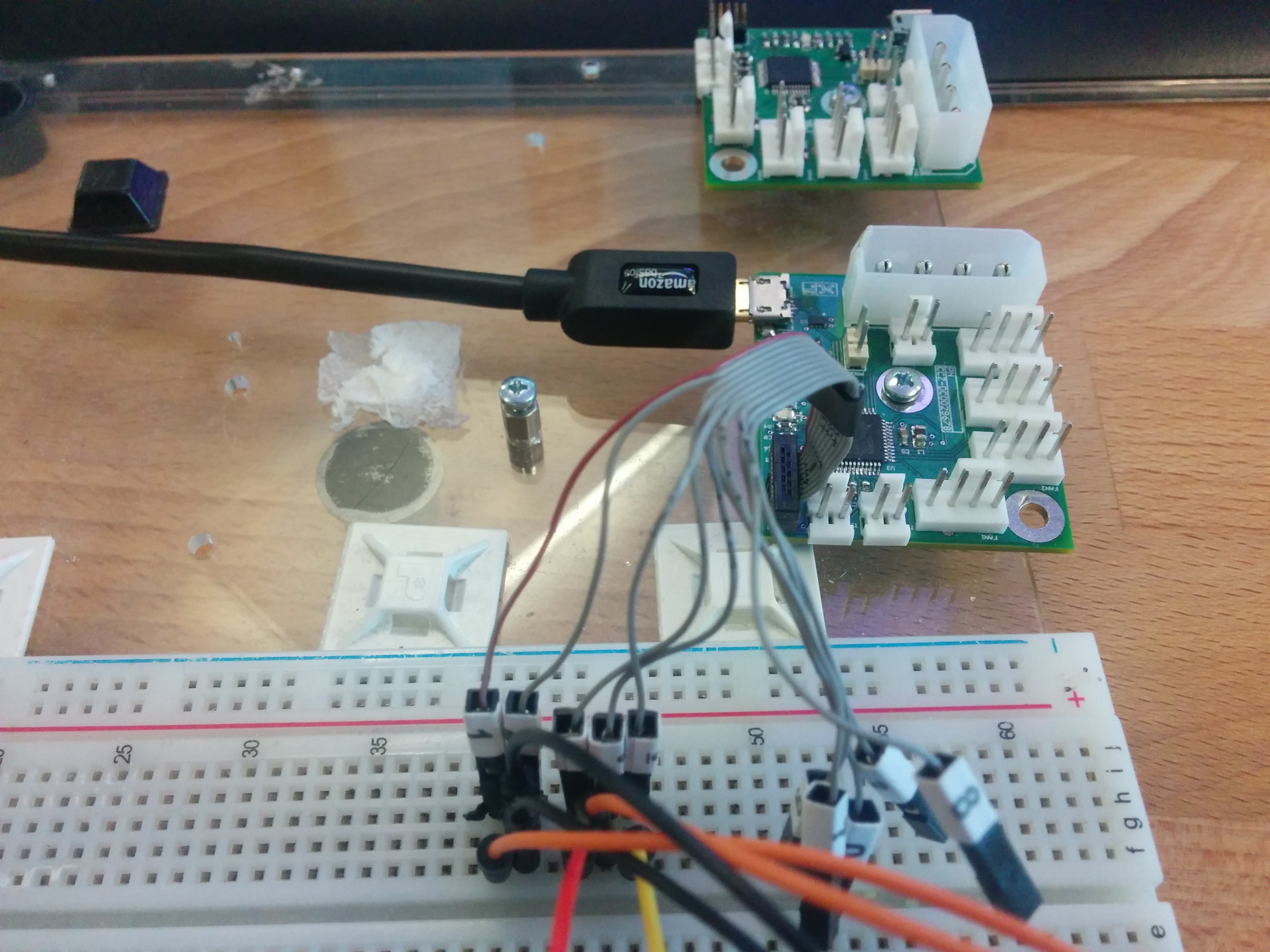 Custom fan controller with 4 4-wire fan connectors with a SAMD Atmel microcontroller. Power supplied with a 4-pin Molex. USB port for external control.