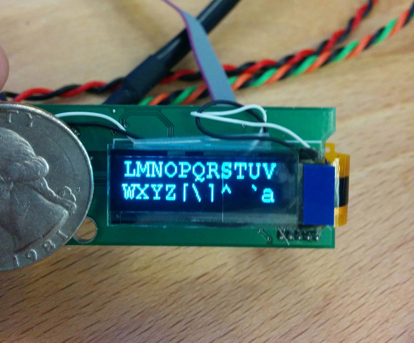 OLED display has two capacitive touch buttons, USB serial interface, and multi-page OLED screen.